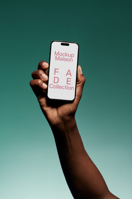 Smartphone mockup held by hand against gradient background showcasing text FADE Collection ideal for designers seeking modern mobile display templates.