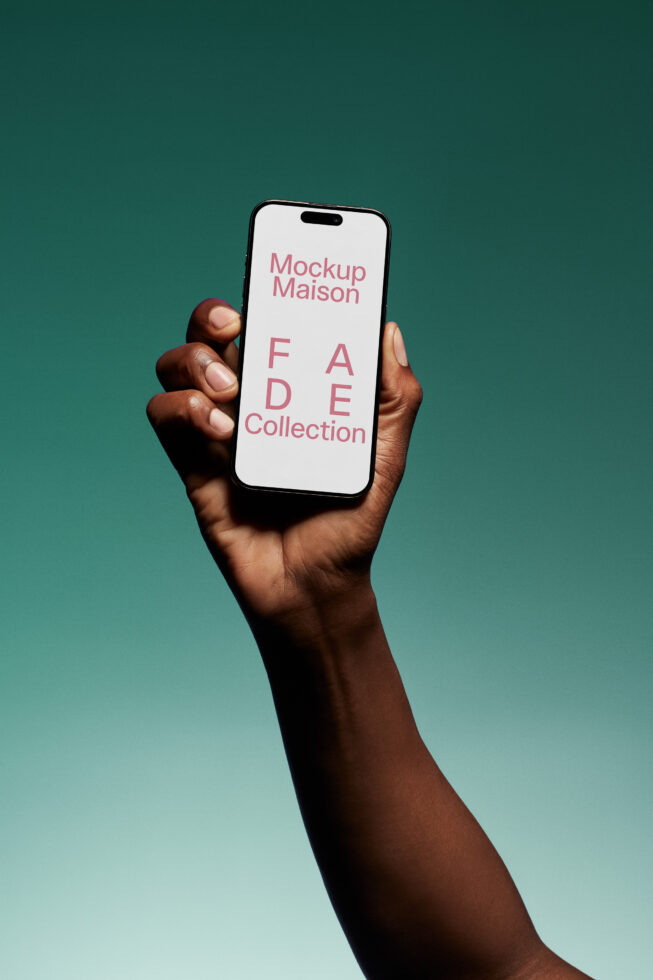 Smartphone mockup held by hand against gradient background showcasing text FADE Collection ideal for designers seeking modern mobile display templates.