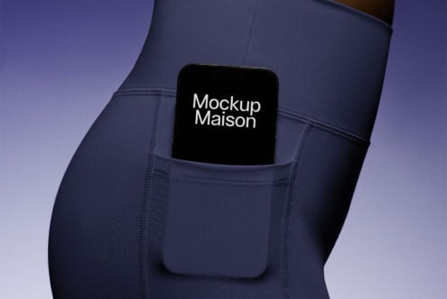 Yoga pants phone mockup featuring a smartphone in a pocket with branding text Mockup Maison. Suitable for apparel design, marketing, e-commerce visuals.