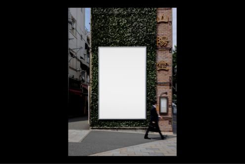 Urban street billboard mockup on ivy-covered wall suitable for showcasing design templates. Ideal for designers showcasing graphics and advertising concepts.