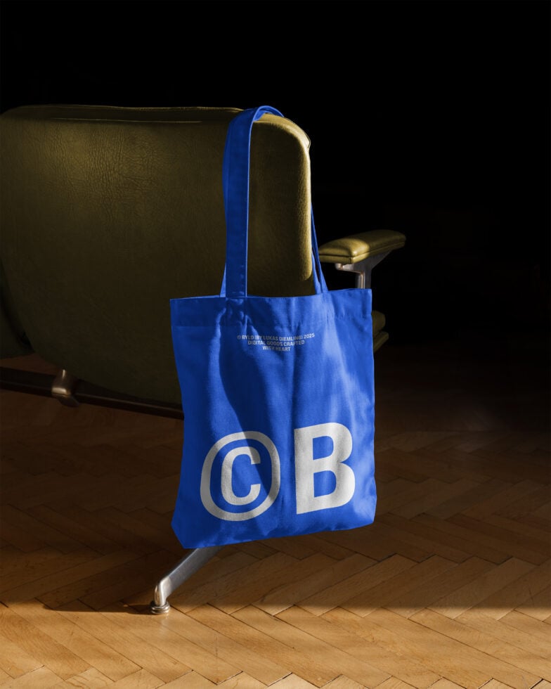 Blue tote bag mockup hanging on a chair featuring bold typography on wood flooring perfect for designers seeking modern graphic presentations