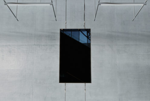 Modern digital screen mockup hanging on a concrete wall background ideal for graphic designers seeking sleek presentation templates in high resolution.