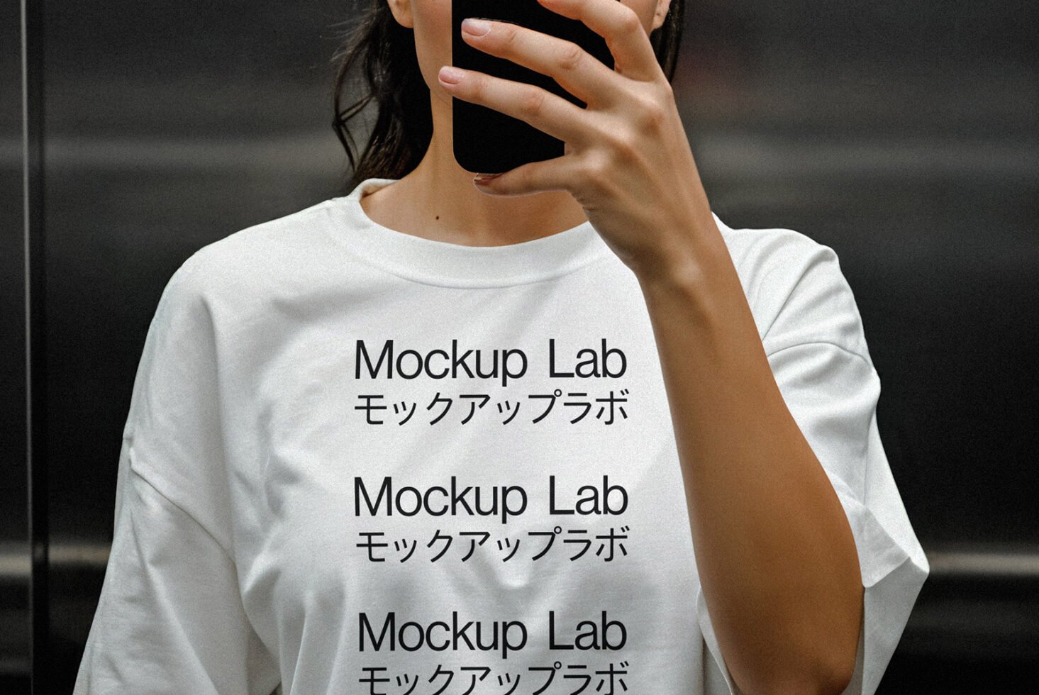White T-shirt mockup featuring bold text in English and Japanese. Ideal for garment designers, showcasing branding or typography design. Fashion mockup.