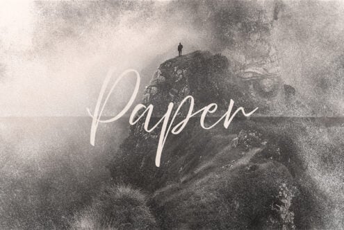 Vintage paper texture design with a silhouette person on a misty mountain. Ideal for graphic templates and backgrounds. Keywords: paper, texture, vintage.