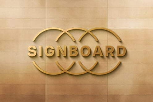 Signboard mockup with golden letters on textured beige wall background for branding presentations, ideal for designers seeking signage templates
