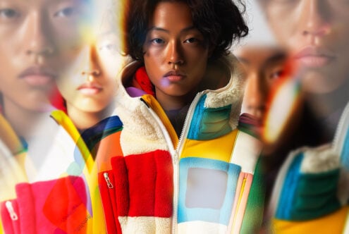Colorful abstract fashion image featuring a person in a vibrant patchwork jacket with overlapping blurred effects suitable for graphics and design projects.
