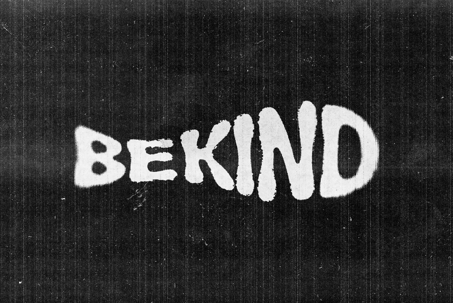 Grunge textured typography graphic with the words Be Kind in white on a dark background ideal for design templates posters and graphics. SEO keywords: typography, design.