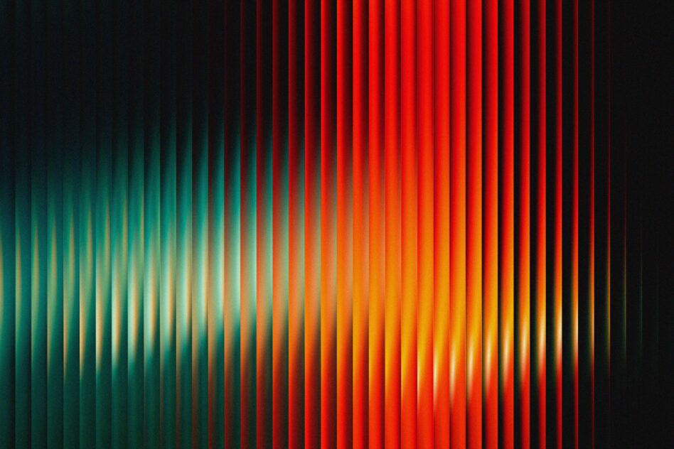 Vertical light streaks background shifting from teal green through yellow to bright red glow