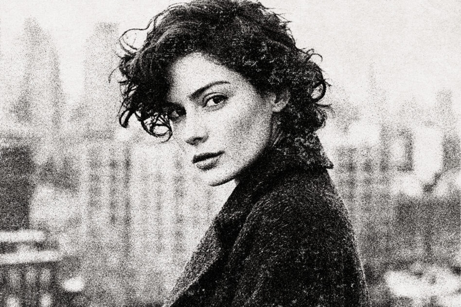 Soft focus vintage portrait with curled hair, contemplative side-eye pose