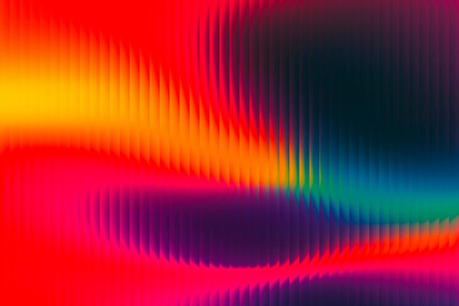 Colorful wavy gradient background with rippling effect, reds fading to blues, teal with distortion
