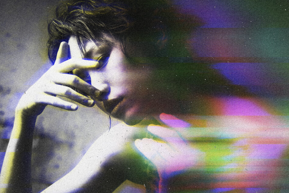 Person's face with vibrant rainbow color wash streaks across image