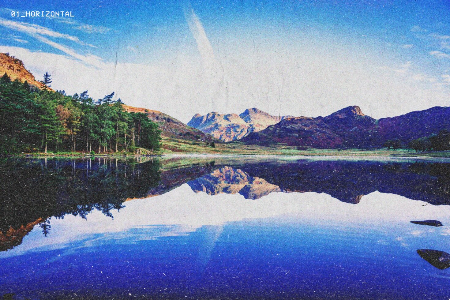 Vintage landscape photo with mountains reflecting in a serene lake, featuring a textured retro effect. Ideal for graphic design or mockup backgrounds.