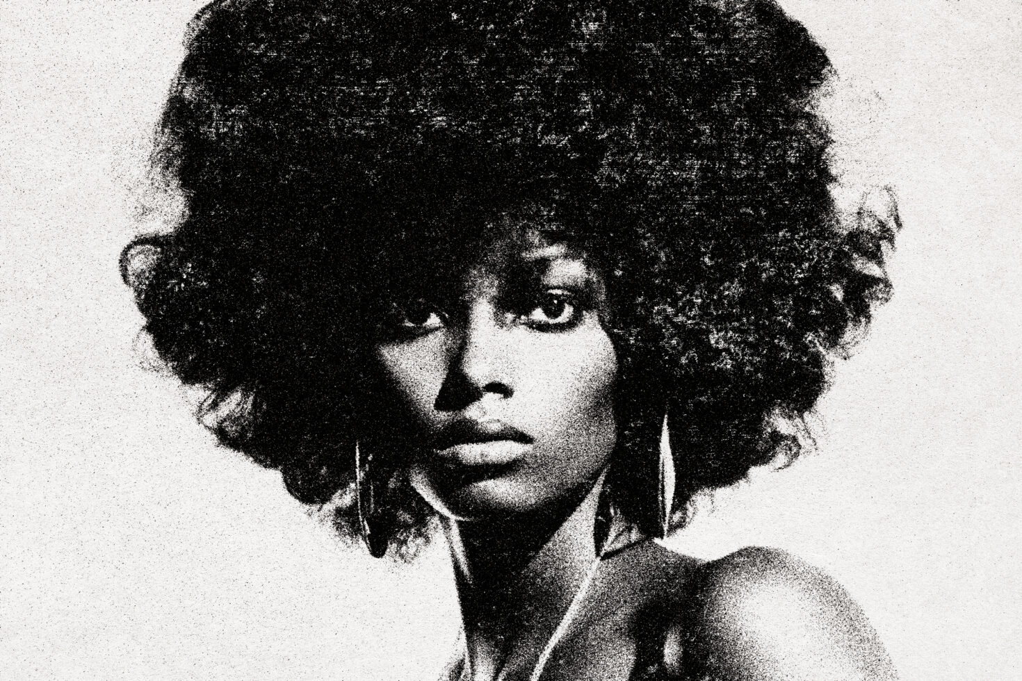 Vintage black and white portrait of a woman with afro hairstyle, ideal for graphic design projects, retro-style mockups, or artistic templates.
