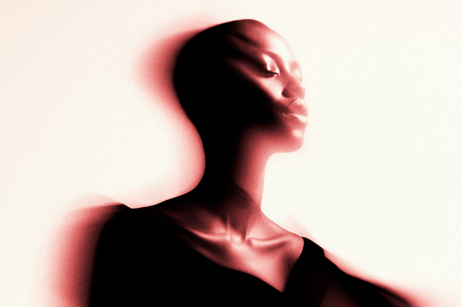 Abstract red-toned portrait of a woman with motion blur effect, creating a dreamy artistic representation. Ideal for graphics, creative design assets.