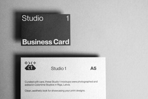 Business card mockup on gray background featuring minimalist design. Ideal for designers seeking modern, professional templates for branding projects.