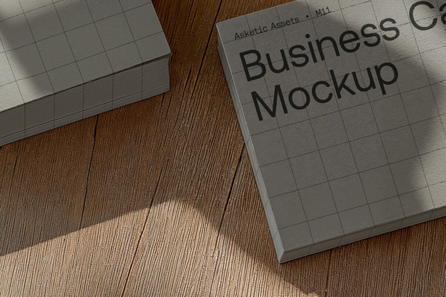 Business card mockup on wooden surface ideal for designers. High-quality graphic showcasing realistic texture. Perfect for showcasing design templates.