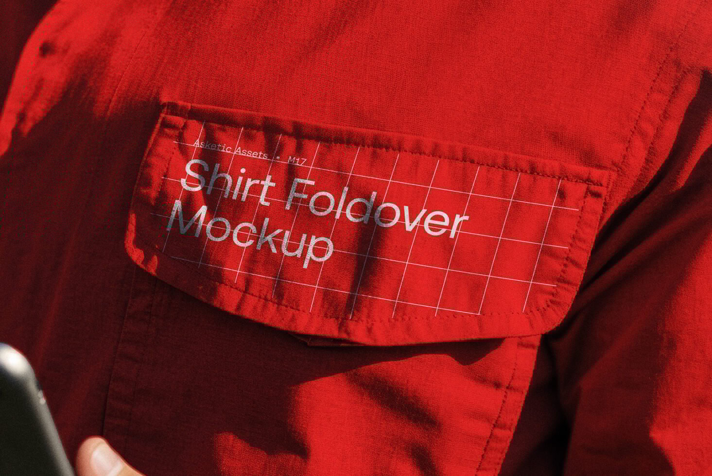 Close-up of a red shirt pocket featuring a shirt foldover mockup design. Ideal for designers seeking realistic clothing mockups for branding projects.