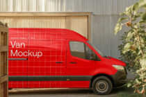 Red delivery van positioned against corrugated metal warehouse backdrop outside