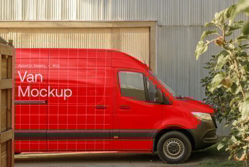 Red van mockup template parked in an industrial area with corrugated metal background, ideal for vehicle branding presentations and graphic design projects.