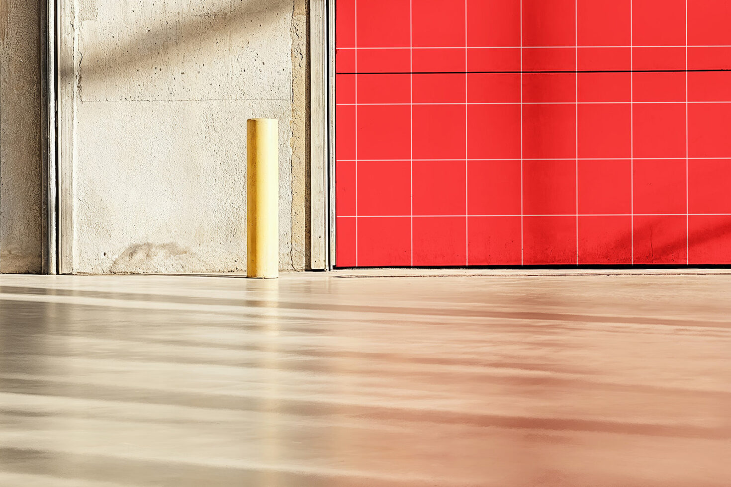 Warehouse interior with a red grid-pattern door and concrete wall. Ideal for background graphics mockups industrial design architecture materials.