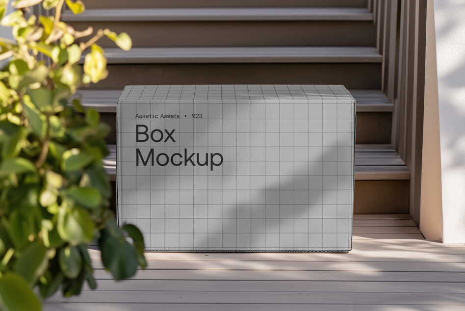 White cardboard box mockup with grid pattern on wooden steps surrounded by plants