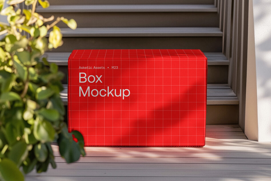 Bright red shipping box mockup with grid pattern on wooden deck with potted plant