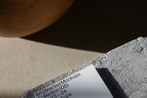 Minimalist mockup featuring textured concrete and paper design template. Ideal for designers seeking modern and artistic mockup assets for projects.