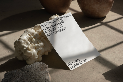 Minimalist A5 card mockup on textured surface featuring Art Directed Mockups collection for designers. Perfect for showcasing graphic design templates.