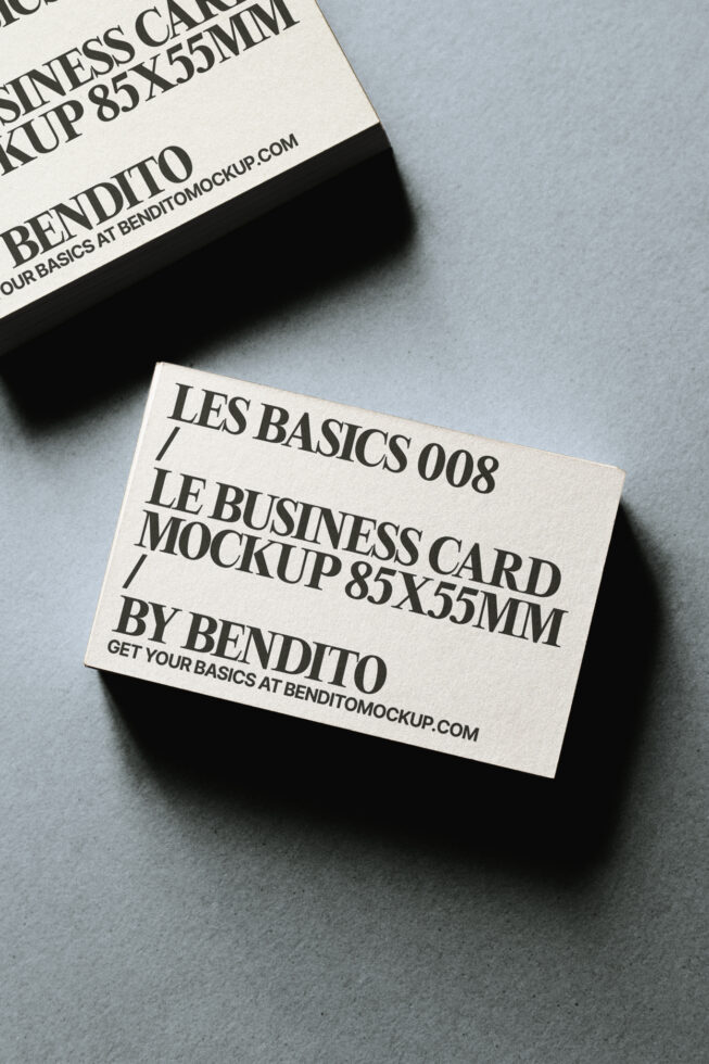 Cream business cards stacked with black text showing Les Basics 008 mockup specs