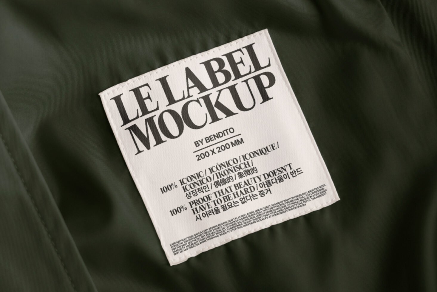 Fabric texture label mockup featuring a white label with bold typography on green fabric background perfect for apparel designers and branding presentations