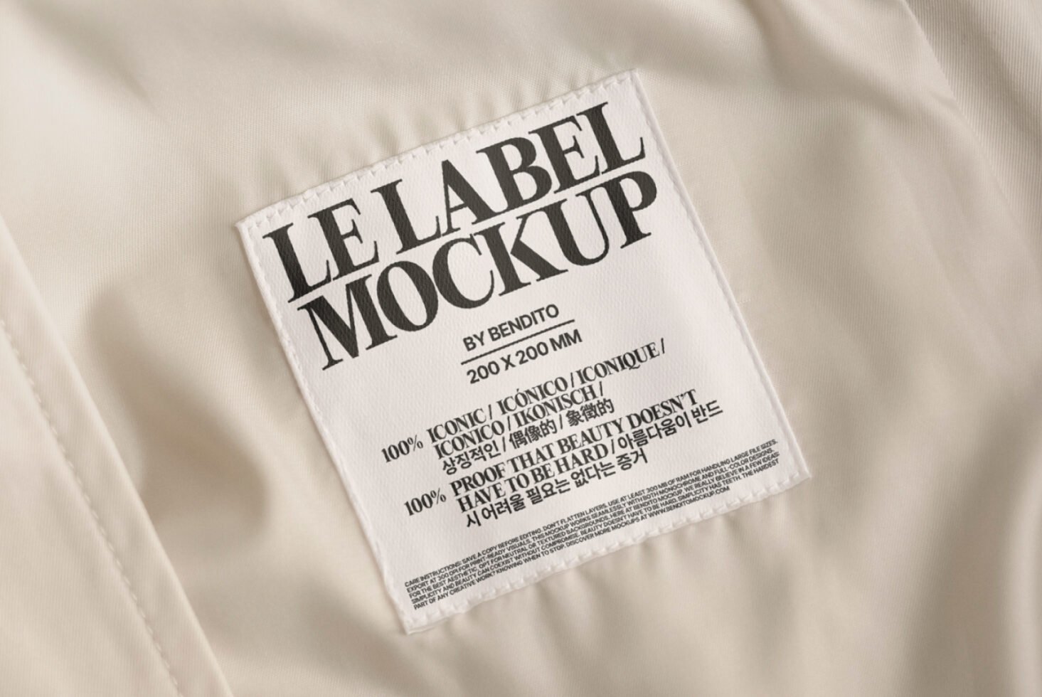 Clothing label mockup on beige fabric, featuring bold typography. Ideal for designers creating realistic apparel branding presentations. Mockups, Graphics.