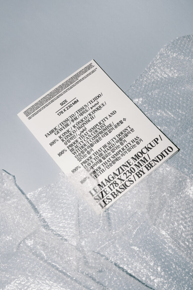 Magazine mockup template on soft blue background with bubble wrap, ideal for designers seeking realistic presentation assets and digital design resources.