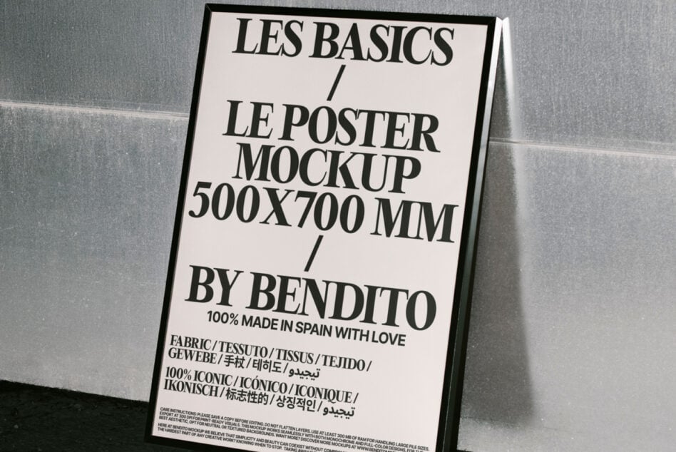 Poster mockup in black frame leaning against metallic wall. Text highlights size 500x700 mm. Ideal for graphic designers seeking minimalist templates.