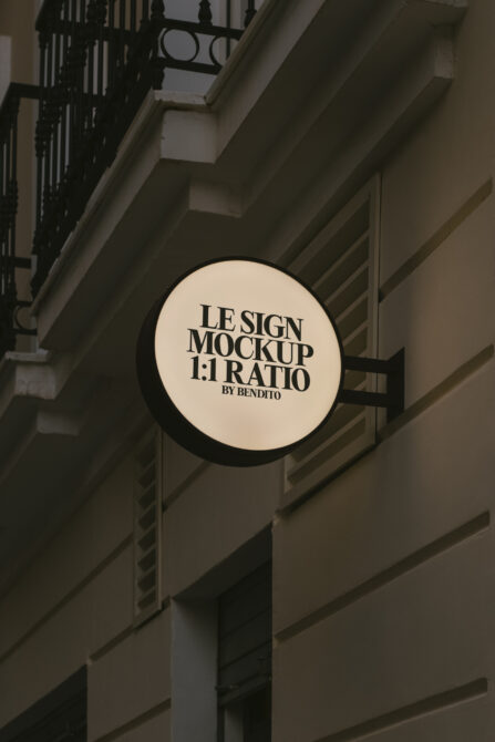 Round shop sign mockup in urban setting ideal for designers. Editable PSD format for realistic branding presentations and identity design templates.