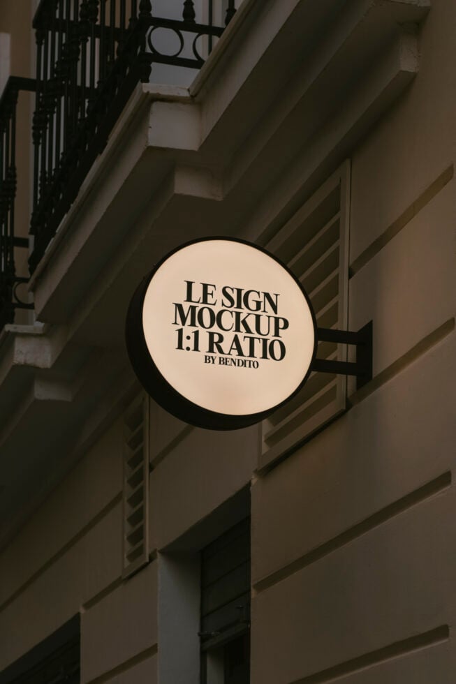 Round shop sign mockup in urban setting ideal for designers. Editable PSD format for realistic branding presentations and identity design templates.