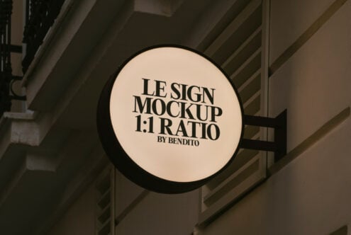 Round sign mockup on a building wall displaying the word Le Sign Mockup 1 to 1 Ratio Ideal for designers creating realistic storefront signage