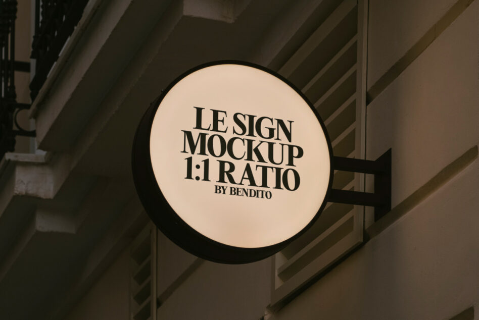 Round sign mockup on a building wall displaying the word Le Sign Mockup 1 to 1 Ratio Ideal for designers creating realistic storefront signage