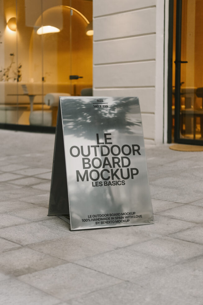 Outdoor board mockup near modern glass building perfect for designers. Realistic template showcasing signage on urban street. Editable PSD for branding.