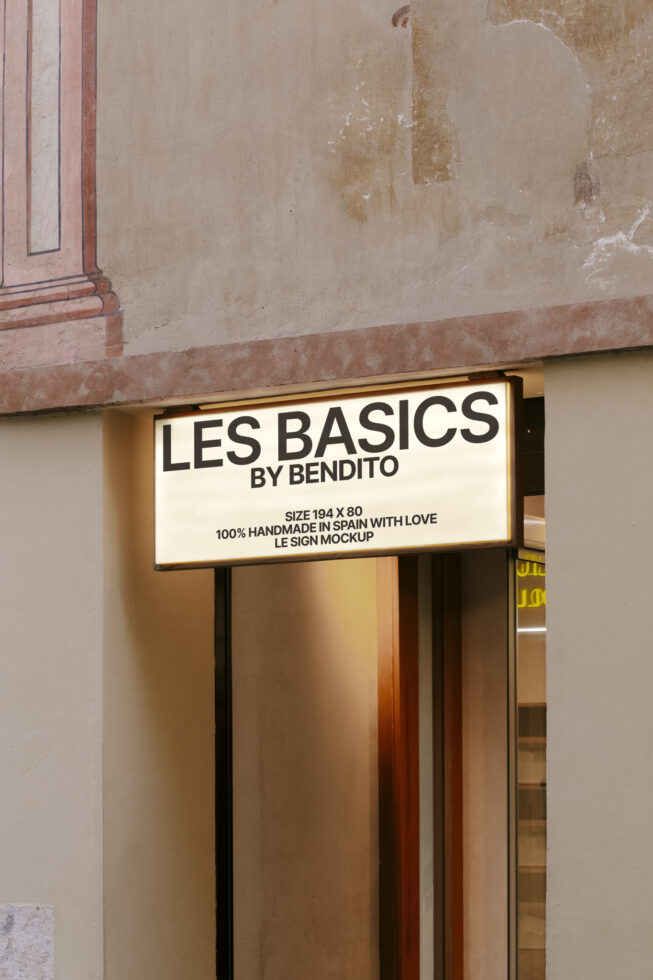 Vintage storefront sign mockup reading Les Basics by Bendito handmade in Spain perfect for designers focusing on branding or retail exterior graphics