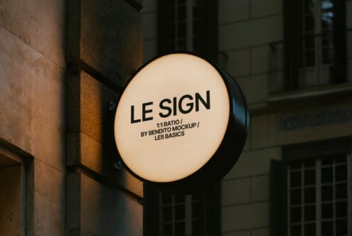 Round outdoor sign mockup template with black letters on a light background perfect for designers optimizing urban branding and signage projects.