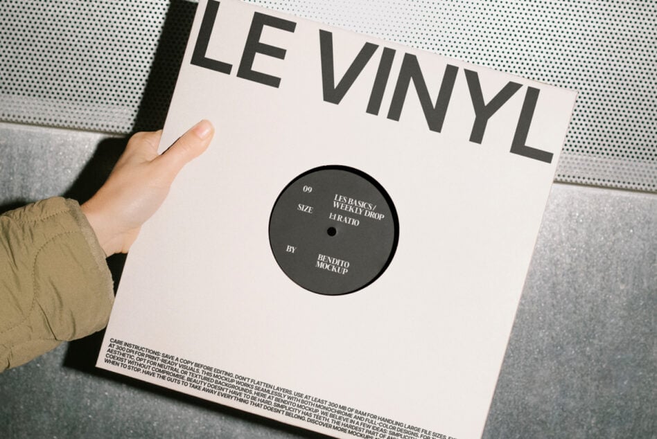 Vinyl record mockup held by hand with a minimalist cover design suitable for showcasing album artwork. Perfect for designers' projects and templates.
