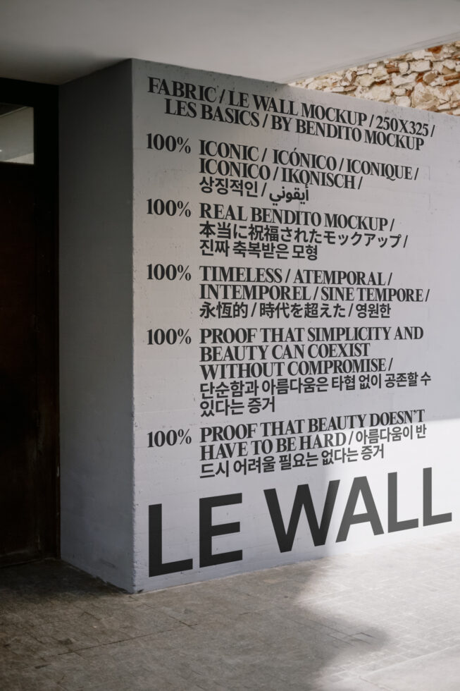 Wall mockup with multilingual bold typography in a modern interior space. Perfect for showcasing display fonts and design layouts to designers.