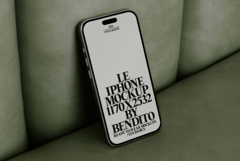 iPhone mockup with 1170x2532px dimensions on a green sofa. Ideal for design presentations. Mockups for designers seeking quality templates.