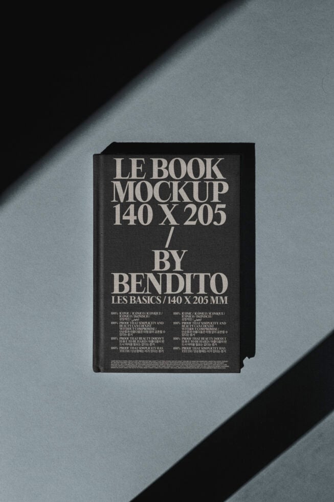 Book mockup 140x205mm displayed on textured surface ideal for designers looking for elegant mockup templates for presentations or portfolio showcases.