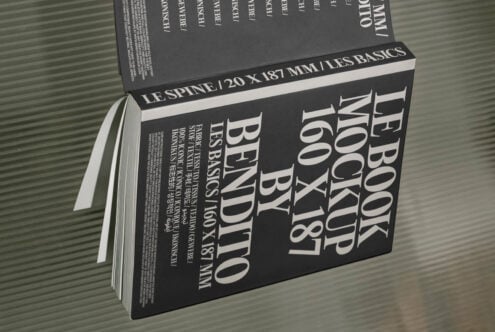 Book mockup with elegant typography on black cover, perfect for designers. Mockups 160x187 mm, hardcover, professional design resource, high resolution.
