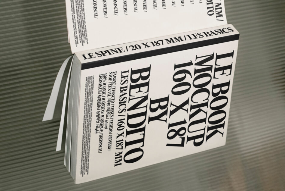 Cream hardcover book mockup photographed from side angle on corrugated background