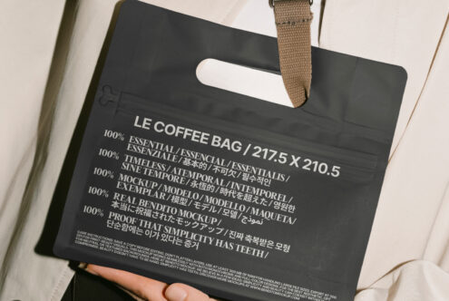 Digital mockup of black coffee bag with multilingual text for designers. Essential for packaging design templates. Perfect for creative projects