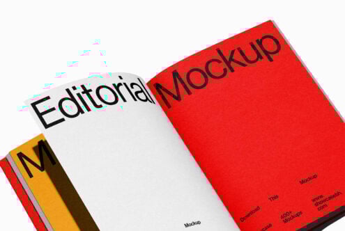 Open book editorial mockup with minimalist design featuring bold black text on red and white pages. Perfect for showcasing magazine layouts and typography.