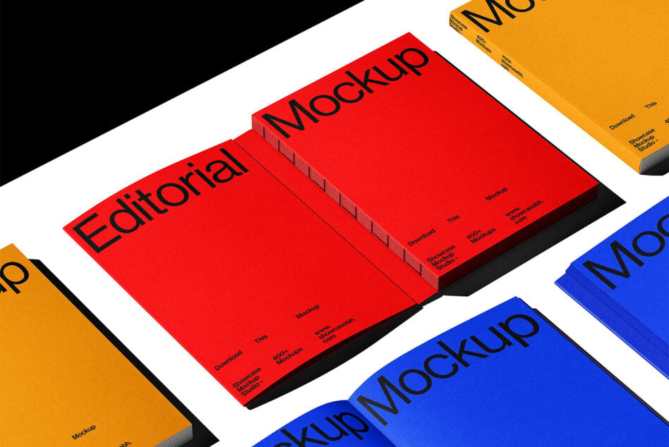 Isometric stack of colorful magazine mockups in red, yellow, blue with Editorial text