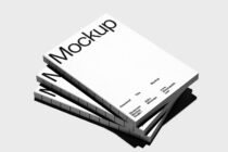 Stacked white magazine mockups angled view with black spine detail